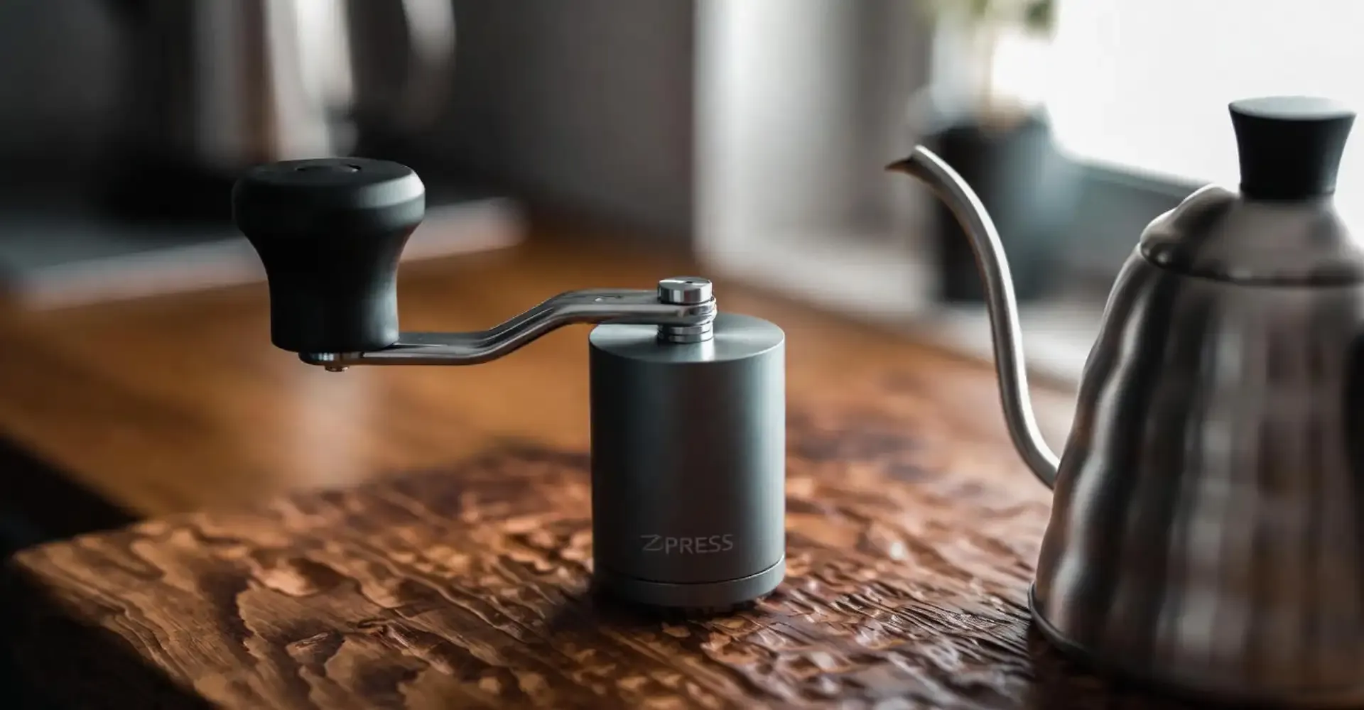 The premium 1Zpresso K-Ultra manual grinder, showcasing its external adjustment dial and foldable handle.